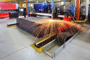 CNC laser machine in PDI's Erie, PA manufacturing facility