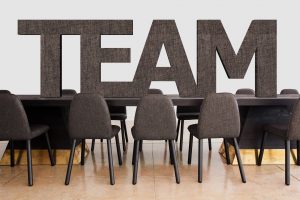 The word team on an office table with chairs
