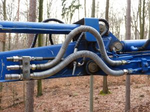 Hydraulic hoses on machinery in woods