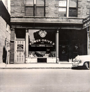 Black and White Photo of power Drives, Inc. Storefront