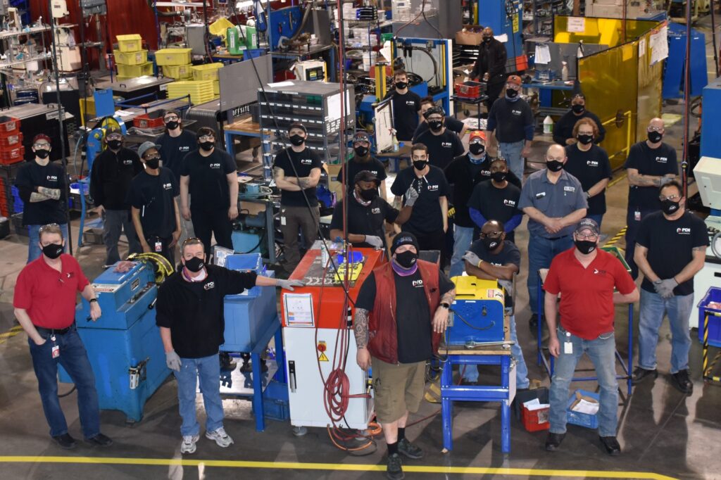 Power Drives employees in manufacturing facility